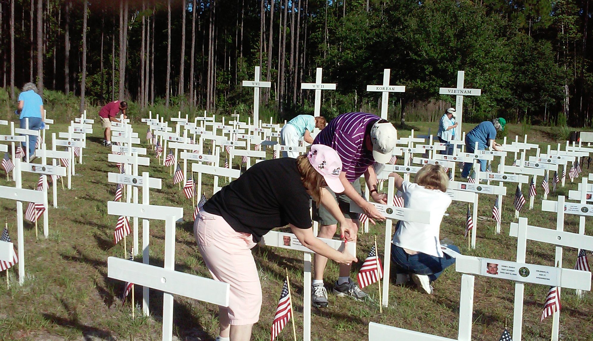 members putting names o crosses