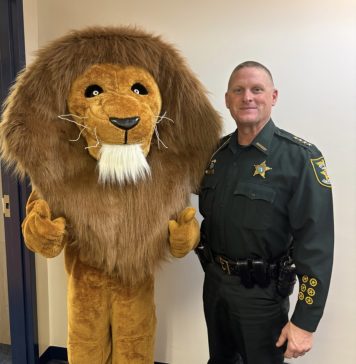Landrum Roars into Spring with Inaugural Lion Fest The Landrum Middle School mascot joins St. Johns County Sheriff Hardwick during the inaugural Lion Fest, which featured a safety talk and community pep rally. Photo courtesy Landrum Middle School PTO