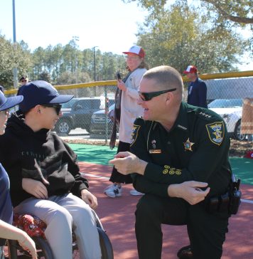St. Johns County Sheriff Robert Hardwick speaks with athletes at the Field of Dreams. Photo courtesy St. Johns County Public Affairs