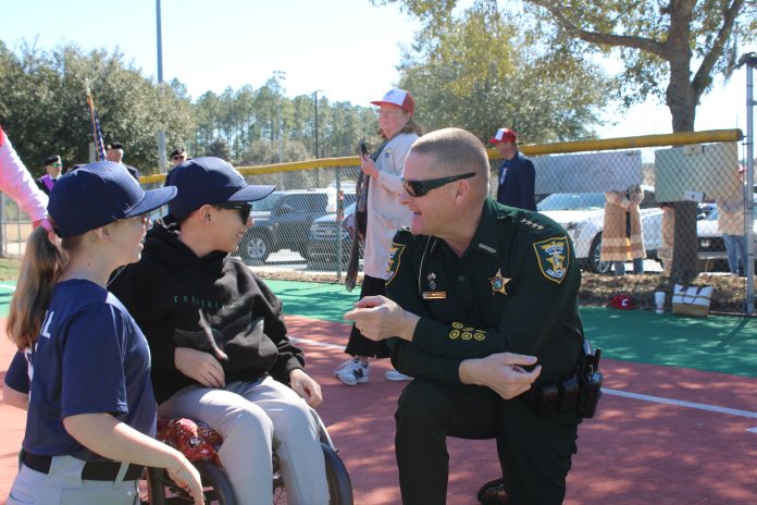 St. Johns County Sheriff Robert Hardwick speaks with athletes at the Field of Dreams. Photo courtesy St. Johns County Public Affairs