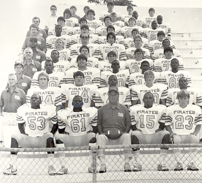 Stockstill and 1985 Pirates Head Coach Joel Stockstill, front and center, with the 1985 Pirates at Buccaneer Field. Also pictured are assistant coaches Larry Phillips, Ken Roland, Jim Stearn, Leonard Peterson, Bob Howard and Larry Beggs, from bottom to top. Submitted photo