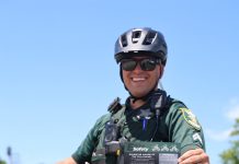 Power on the Path: SJSO leads education-first initiative to bridge the gap between technology and traffic law Cpl. Michael Ettel displays the St. Johns County Sheriff’s Office e-bike safety card, which outlines the differences between electric bicycle classes and illegal e-motos. Photo courtesy St. Johns County Sheriff's Office