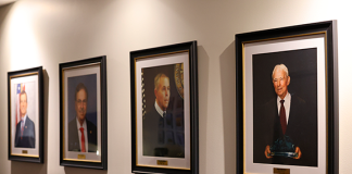 Portraits of four former State Attorneys who served Florida’s Seventh Judicial Circuit now hang at the S. James Foxman Justice Center in Daytona Beach. Photo by Haley Harrison, Office of State Attorney R.J. Larizza