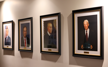 Portraits of four former State Attorneys who served Florida’s Seventh Judicial Circuit now hang at the S. James Foxman Justice Center in Daytona Beach. Photo by Haley Harrison, Office of State Attorney R.J. Larizza