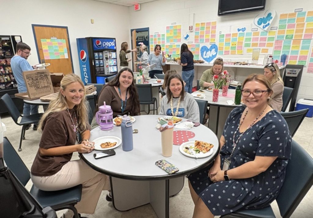 Teachers and staff enjoy a pizza and salad luncheon, one of several themed meals provided during the week. Photo courtesy Ocean Palms Elementary PTO
