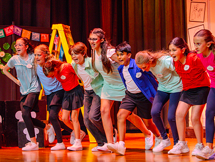 Students perform a coordinated dance routine during the "Dare to Dream" show at Hickory Creek Elementary. Photo courtesy Hickory Creek Elementary