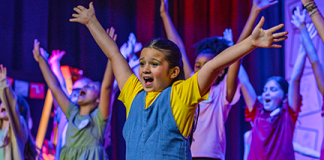 A young performer sings during Hickory Creek Elementary's production of "Dare to Dream" held April 8-10. Photo courtesy Hickory Creek Elementary