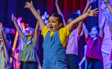 A young performer sings during Hickory Creek Elementary's production of "Dare to Dream" held April 8-10. Photo courtesy Hickory Creek Elementary