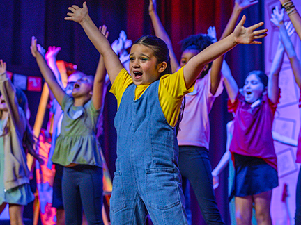 IMG_9445-web A young performer sings during Hickory Creek Elementary's production of "Dare to Dream" held April 8-10. Photo courtesy Hickory Creek Elementary