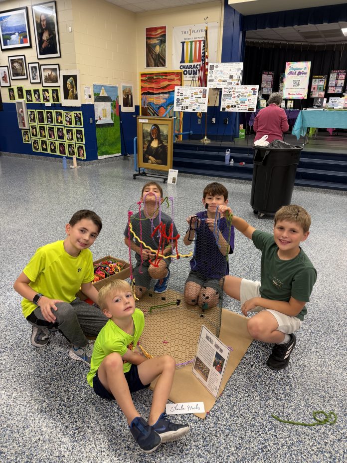 Students work on a collaborative art piece during Ocean Palms Elementary's Family Night. Photo courtesy Ocean Palms Elementary PTO