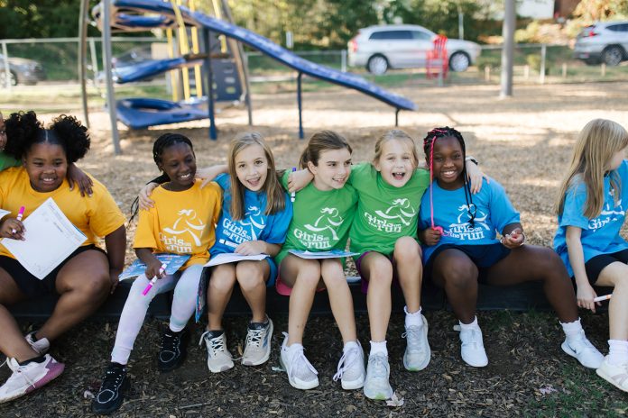 GOTR 2024 Girls on the Run teammates sit together during a program session at the park. Photo courtesy Girls on the Run