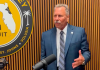 State Attorney R.J. Larizza speaks near a podcast recording setup at his office. Submitted
