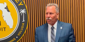 State Attorney R.J. Larizza speaks near a podcast recording setup at his office. Submitted