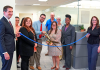 From left, Clerk Brandon Patty, Deputy Clerk Randy Beck, Recording Supervisor Kimberly Jarrell, Minutes & Records Director Matt Shuler, Deputy Clerk Adam Ehrenberg, Recording Director Kati Smith, Deputy Clerk Connie Logan, Deputy Clerk Zhane Brown and Master Clerk Rita Rios cut the ribbon on the new Public Service Center Monday, Aug. 3, 2026. Photo courtesy of St. Johns County Clerk of the Circuit Court and County Comptroller's Office