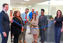 From left, Clerk Brandon Patty, Deputy Clerk Randy Beck, Recording Supervisor Kimberly Jarrell, Minutes & Records Director Matt Shuler, Deputy Clerk Adam Ehrenberg, Recording Director Kati Smith, Deputy Clerk Connie Logan, Deputy Clerk Zhane Brown and Master Clerk Rita Rios cut the ribbon on the new Public Service Center Monday, Aug. 3, 2026. Photo courtesy of St. Johns County Clerk of the Circuit Court and County Comptroller's Office