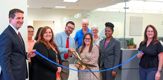 From left, Clerk Brandon Patty, Deputy Clerk Randy Beck, Recording Supervisor Kimberly Jarrell, Minutes & Records Director Matt Shuler, Deputy Clerk Adam Ehrenberg, Recording Director Kati Smith, Deputy Clerk Connie Logan, Deputy Clerk Zhane Brown and Master Clerk Rita Rios cut the ribbon on the new Public Service Center Monday, Aug. 3, 2026. Photo courtesy of St. Johns County Clerk of the Circuit Court and County Comptroller's Office