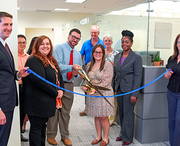 From left, Clerk Brandon Patty, Deputy Clerk Randy Beck, Recording Supervisor Kimberly Jarrell, Minutes & Records Director Matt Shuler, Deputy Clerk Adam Ehrenberg, Recording Director Kati Smith, Deputy Clerk Connie Logan, Deputy Clerk Zhane Brown and Master Clerk Rita Rios cut the ribbon on the new Public Service Center Monday, Aug. 3, 2026. Photo courtesy of St. Johns County Clerk of the Circuit Court and County Comptroller's Office