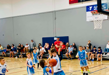 Young athletes compete during a First Coast YMCA youth basketball game. Photo courtesy of First Coast YMCA
