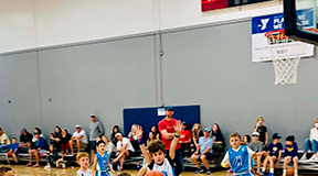 Young athletes compete during a First Coast YMCA youth basketball game. Photo courtesy of First Coast YMCA