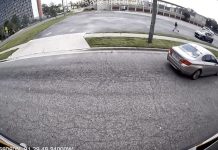 Stop-arm camera footage shows a car passing a stopped school bus on North Jefferson Street. Photo courtesy Duval County Public Schools