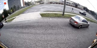 Stop-arm camera footage shows a car passing a stopped school bus on North Jefferson Street. Photo courtesy Duval County Public Schools