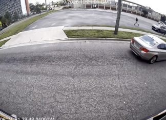 Stop-arm camera footage shows a car passing a stopped school bus on North Jefferson Street. Photo courtesy Duval County Public Schools