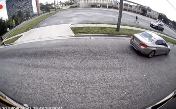 Stop-arm camera footage shows a car passing a stopped school bus on North Jefferson Street. Photo courtesy Duval County Public Schools