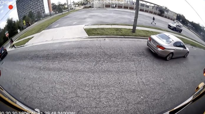 Stop-arm camera footage shows a car passing a stopped school bus on North Jefferson Street. Photo courtesy Duval County Public Schools